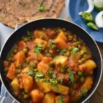 Aloo Matar is a simple, spicy, tangy potato and green peas curry. Serve with any kind of flatbread and rice recipe to enjoy this vegan aloo matar best.