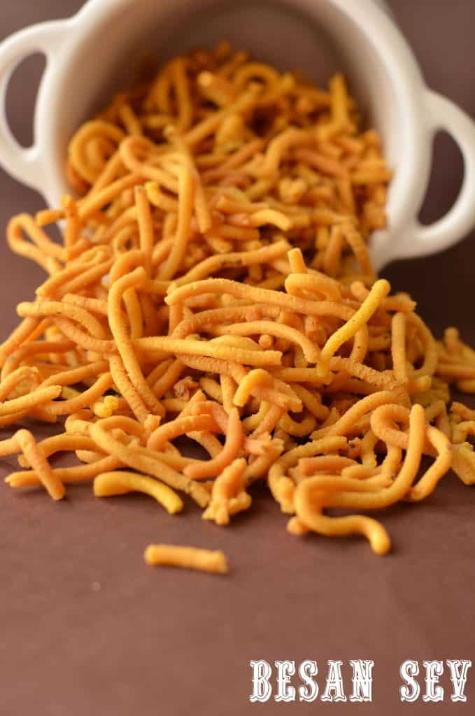 Besan sev is a very famous snack prepared in every household kitchen in India. It is a blend of besan or gram flour and a few spices, which is deep-fried. They are crisp and savory in taste and a great tea time snack. This snack is made during Holi or Diwali, though you can cook throughout the year