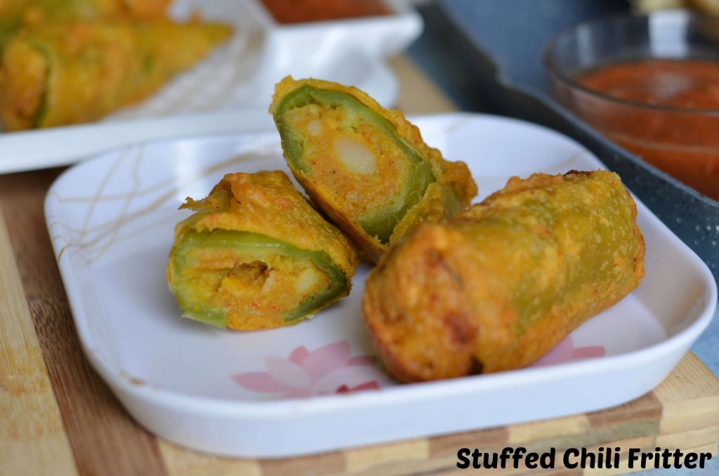Bherwa Mirch ka pakora is stuffed green peppers with mashed potatoes filling with some aromatics spices, dipped in spicy besan (gram flour) batter and deep fried. It is a popular Rajasthani street food known as bherwa mirch vada too.