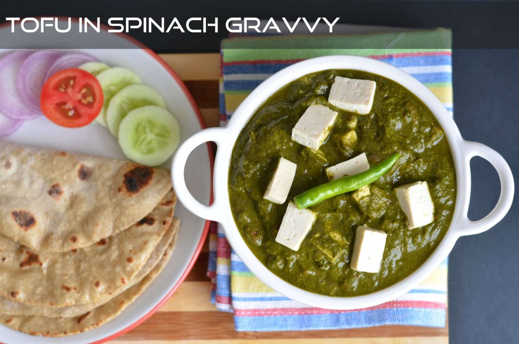 Tofu palak or tofu in spinach gravy is pan fried tofu, cooked in spinach puree with onion-tomato and garam masala. Garnished with fresh cream this lip-smacking tofu palak gravy is a great combination with nan or rice. You can never go wrong with this delicious dish.