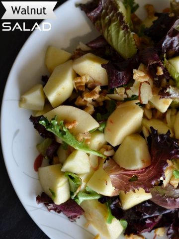This apple walnut salad brings you sweet and tangy flavors with greens. Very simple and easy to make. Just add a dash of lemon, a little quantity of maple syrup with some salt and you are set to munch on this apple walnut salad.