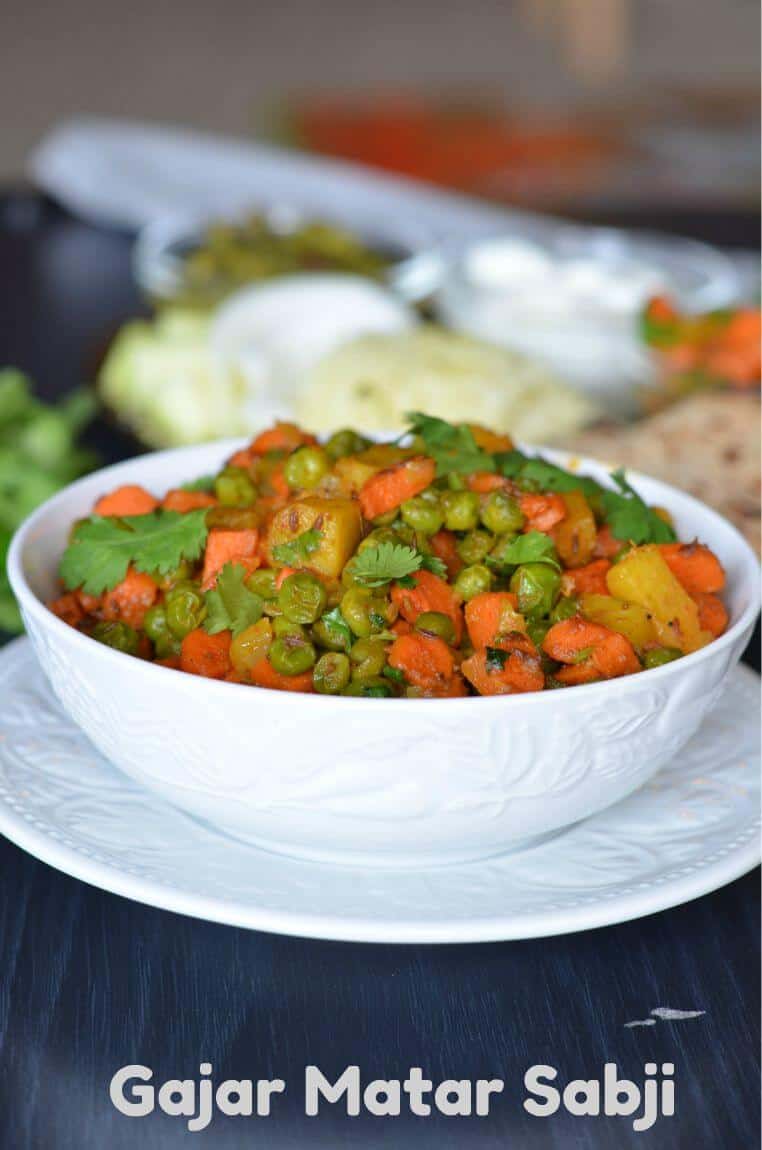 Gajar Matar sabji is a dry mix of carrots and peas sauteed in oil with spices. A very simple dish to use all seasonal veggies and create a flavorful dish. This gajar matar ki sabji is cooked mostly in winters because that's when fresh carrots and peas are available in the market.