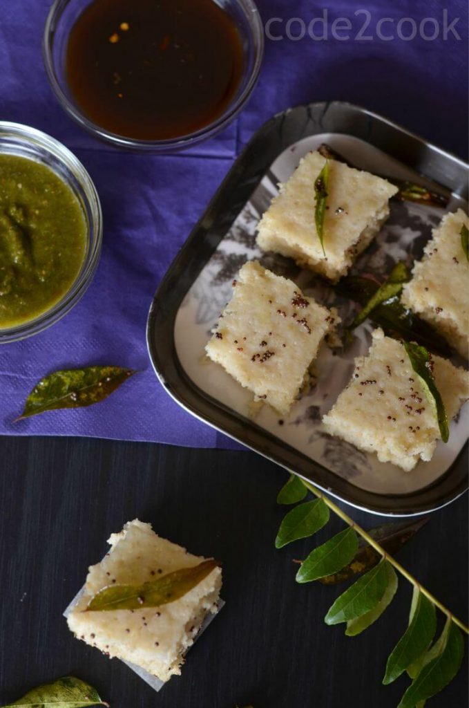 Oats dhokla is the instant dhokla recipe with oats flour, semolina and curd in equal portions, which is a savory and steamed snack or a great breakfast or a great meal in itself. Seasoned with mustard seeds, curry leaves and green chilies this oats dhokla is a perfect guilt-free food to consume.