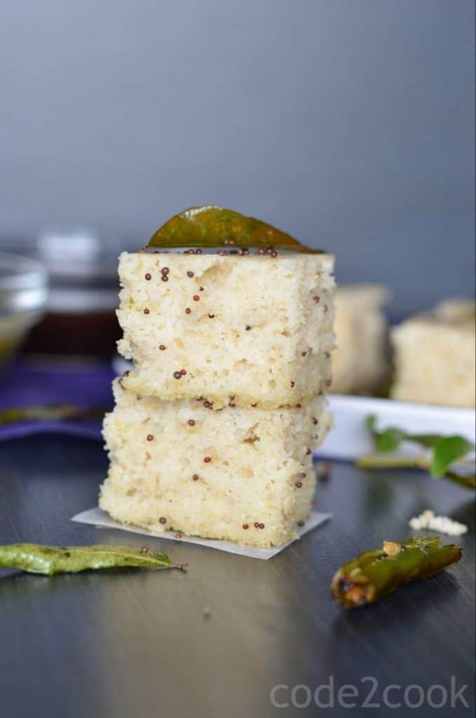 Oats dhokla is the instant dhokla recipe with oats flour, semolina and curd in equal portions, which is a savory and steamed snack or a great breakfast or a great meal in itself. Seasoned with mustard seeds, curry leaves and green chilies this oats dhokla is a perfect guilt-free food to consume.