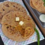 Besan paratha or masala besan paratha is a wonderful Rajasthani paratha recipe which is prepared by stuffing spicy besan or gram flour filling in the whole wheat dough. This paratha is crispy, aromatic and filled with the pickled flavor besan stuffing makes a wholesome meal.
