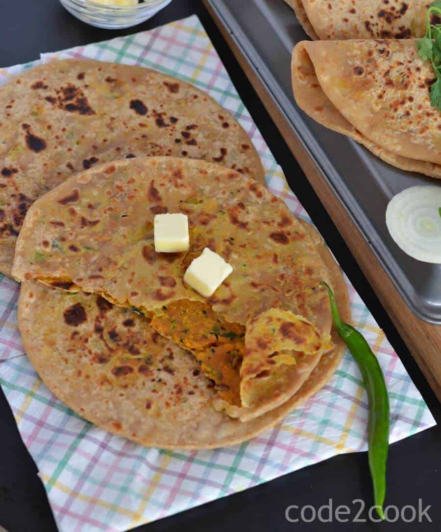 Besan paratha or masala besan paratha is a wonderful Rajasthani paratha recipe which is prepared by stuffing spicy besan or gram flour filling in the whole wheat dough. This paratha is crispy, aromatic and filled with the pickled flavor besan stuffing makes a wholesome meal.