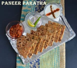 Paneer Paratha is very famous paratha and often served with curd or pickle mostly in every restaurant in India. This is an Indian flatbread which is stuffed with grated paneer or cottage cheese stuffing and seasoned with few spices. A great tiffin box recipe and can be eaten in any meal.