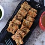 Farali kothimbir vadi is a crispy steamed snack made with green coriander and amaranth flour. It is a famous Gujarati snack which steamed and then fried.