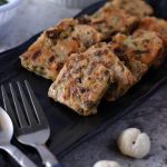 Farali kothimbir vadi is a crispy steamed snack made with green coriander and amaranth flour. It is a famous Gujarati snack which steamed and then fried.
