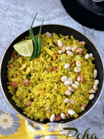 Indori poha recipe which is a famous street food and a staple breakfast in Madhya Pradesh. Indori Poha Sprinkled with sev or bhujiya and served with jalebi is the unique combination which makes it stand out.