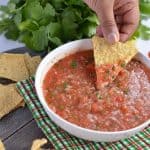 Tomato salsa is one of the most popular Mexican side dish served with tortilla chips. It is tomato based sauce and great with chips, tacos, burritos, and wraps.