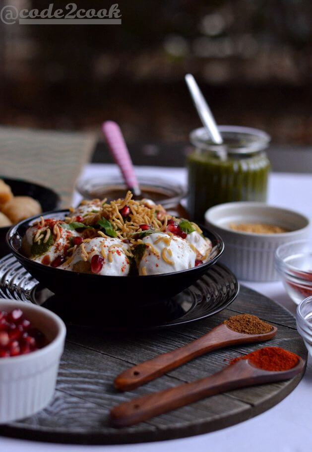 Moong dal dahi vada is a light and delicious Indian street food (Indian chat recipe) made with yellow lentil. Moong dal vadas are deep fried lentil dumplings, soaked in salty water and then served with beaten curd, green chutney, and sweet tamarind chutney.A perfect snack recipe for evening snacks or special occasions or festivals like Holi, Diwali.