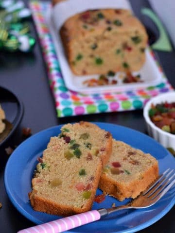 Whole wheat Tutti Frutti cake is eggless, easy to make, soft, moist and a perfect tea time cake. This is a no fail eggless tutti frutti cake recipe to make at home.