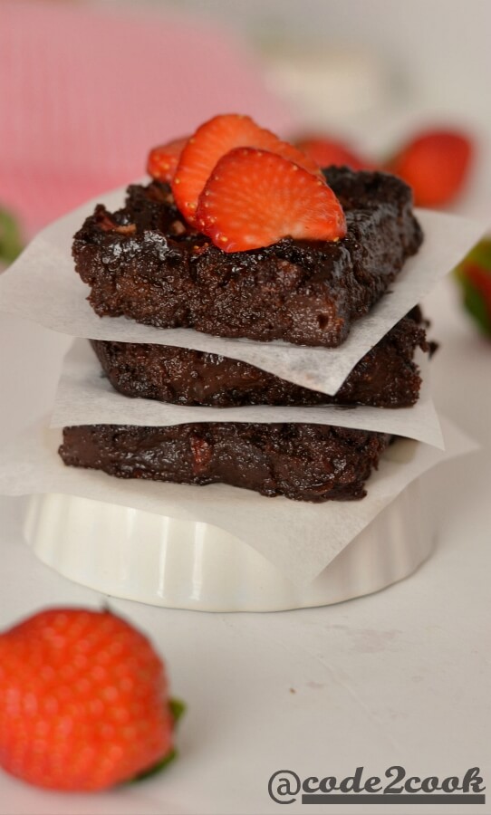 Eggless strawberry brownie is a sweet, tangy, and chocolate flavored fudge brownie for Valentine's day but can be made on any occasion. Basically, it is kind of chocolate covered strawberries in fudgy brownie form. Eggless Strawberry brownie is easy to make brownie recipe with healthy ingredients and fresh strawberries. It is best served with vanilla ice cream or whipped cream or just sliced strawberries.