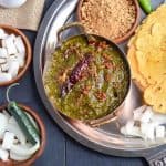 sarson ka saag platter with makki ki roti, ghee, radish, and jaggery
