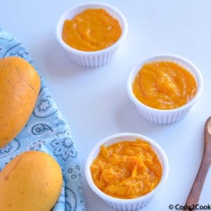 3 types of mango puree served in white remkins.