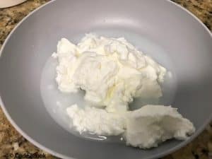 Whisking yogurt with water