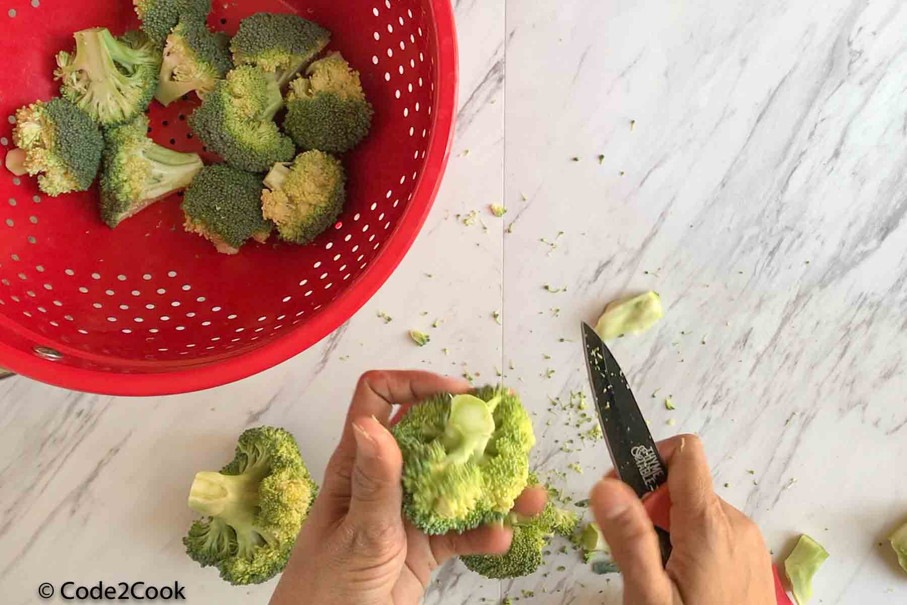 cutting broccoli in medium sized florets